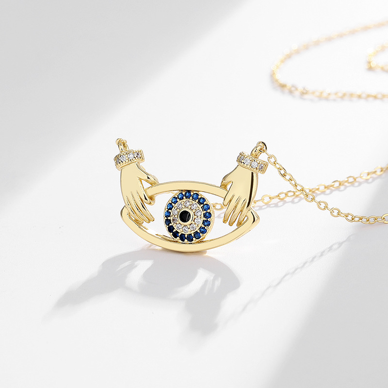 Cross-border Amazon new Devil's Eye necklace Women's European and American fashion hands hug pendant jewelry women's advanced sense